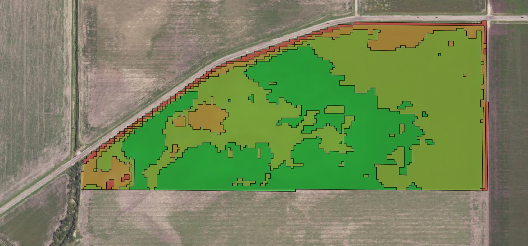 A field split into productivity zones — high-vigor greens through lower gold and red — coloured by class